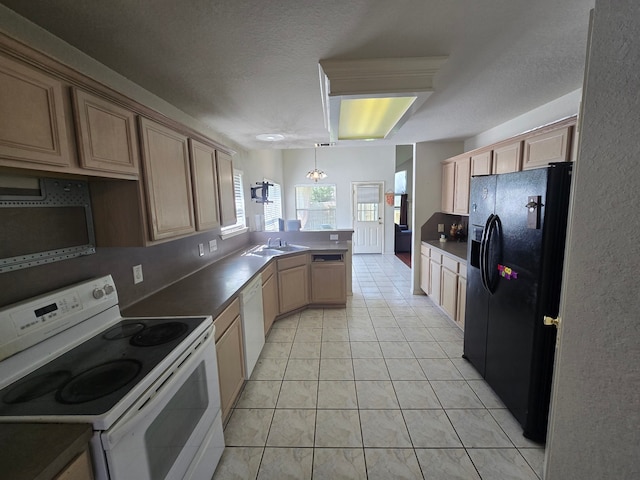 4731 Mohegan Ct, Baytown, TX 77521 - kitchen with light tile patterned flooring, a sink, white appliances, a textured ceiling, and a peninsula
