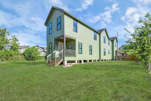 back of house featuring a yard