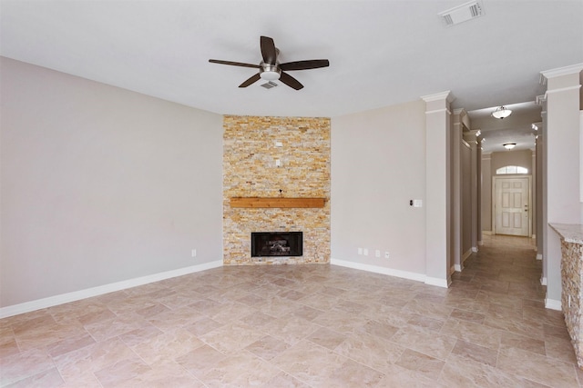 unfurnished living room featuring ceiling fan, visible vents, baseboards, and a stone fireplace