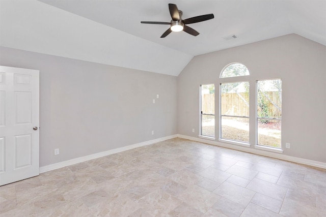 spare room featuring lofted ceiling, a ceiling fan, visible vents, and baseboards