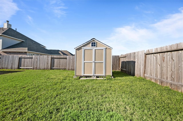 view of shed with a fenced backyard