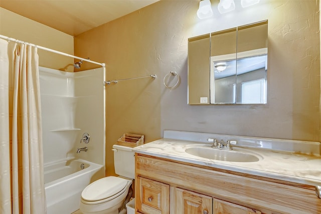 bathroom featuring vanity, toilet, and shower / bath combo with shower curtain