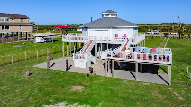 back of property featuring stairs, a lawn, a patio area, and fence