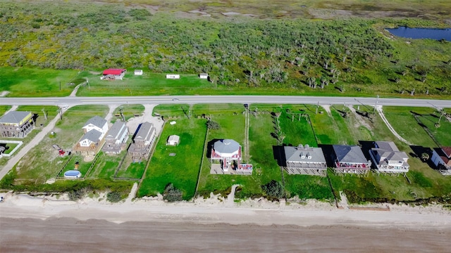 birds eye view of property with a water view and a residential view