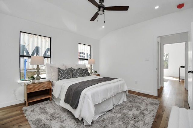 bedroom featuring recessed lighting, wood finished floors, a ceiling fan, baseboards, and vaulted ceiling