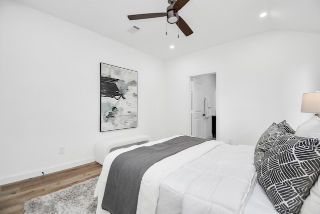 bedroom with lofted ceiling, recessed lighting, wood finished floors, visible vents, and baseboards