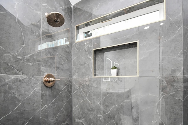 bathroom featuring tiled shower