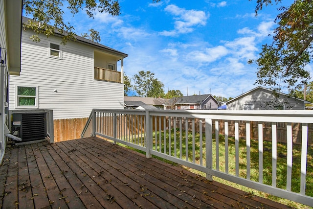 deck featuring a residential view and central air condition unit