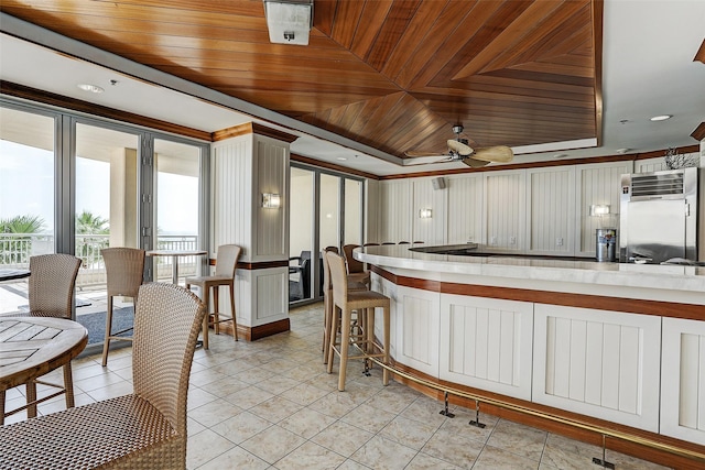 801 E Beach Dr Unit Bc2412, Galveston, TX 77550 - kitchen with a ceiling fan, wood ceiling, light tile patterned flooring, and light countertops