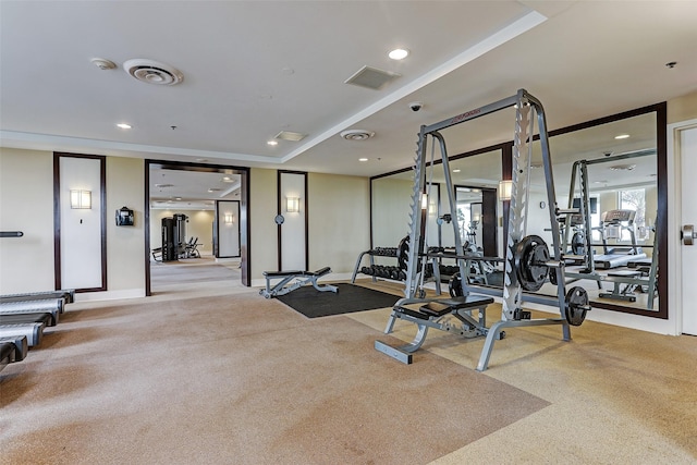 exercise room featuring carpet flooring, recessed lighting, and visible vents