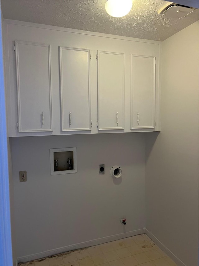 laundry area featuring hookup for an electric dryer, cabinet space, baseboards, gas dryer hookup, and hookup for a washing machine