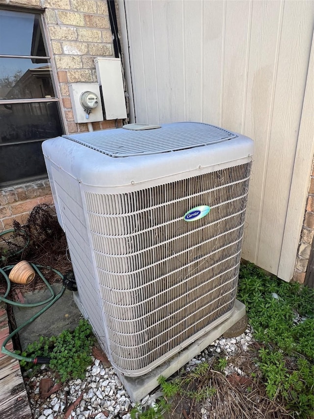 exterior details featuring central AC unit and electric meter