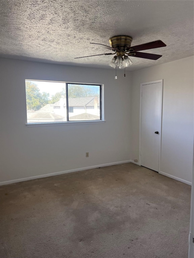 spare room featuring baseboards, carpet, and a healthy amount of sunlight