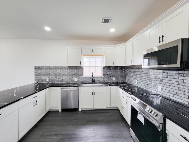 kitchen featuring a sink, visible vents, appliances with stainless steel finishes, and white cabinetry