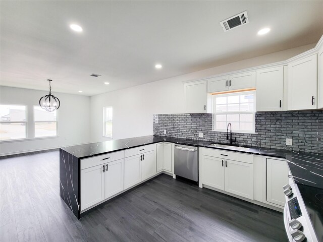 2731 Rd 5724, Cleveland, TX 77327 - kitchen featuring appliances with stainless steel finishes, a sink, a peninsula, dark countertops, and recessed lighting
