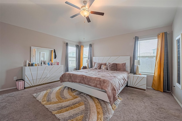 carpeted bedroom with baseboards and ceiling fan