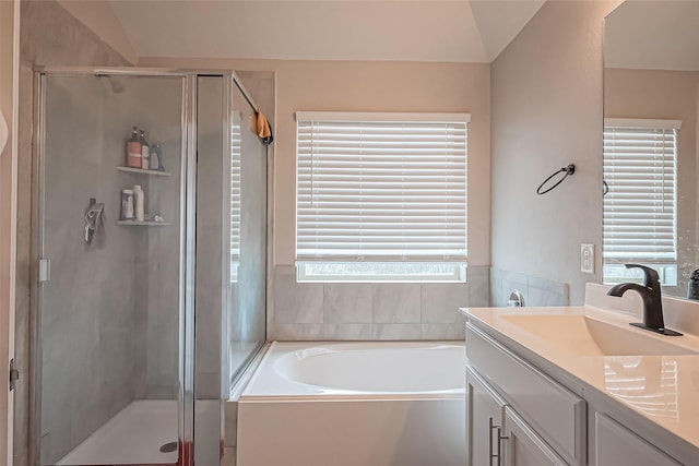 bathroom with vanity, a shower stall, and a bath