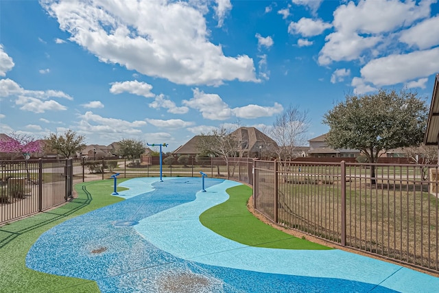 view of community with fence