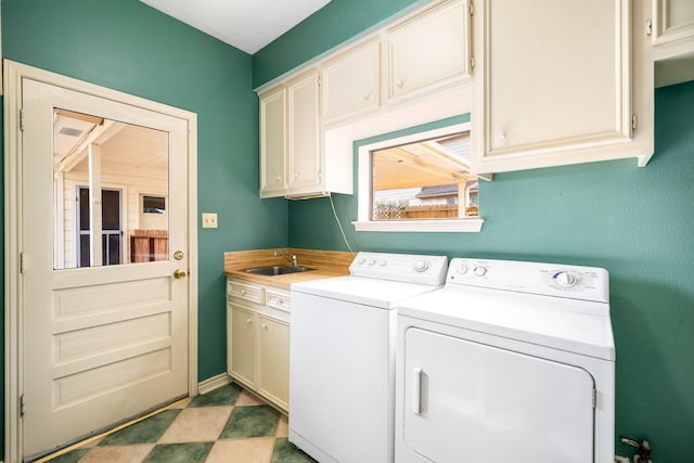 12215 Clearfork Dr, Houston, TX 77077 - clothes washing area with separate washer and dryer and cabinet space