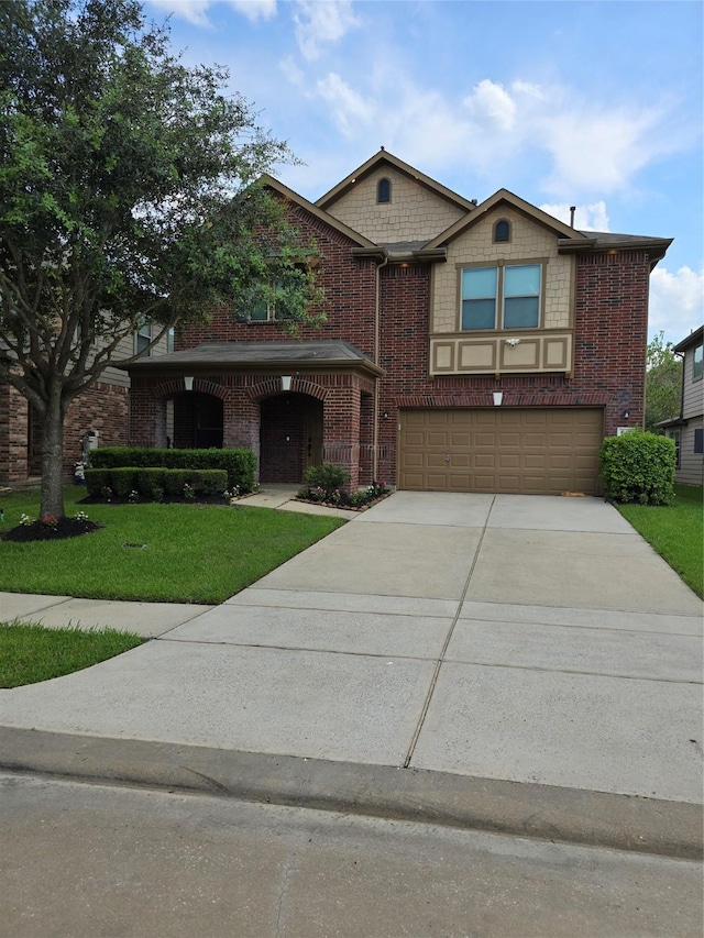 view of front of home with a front lawn, concrete driveway, brick siding, and an attached garage