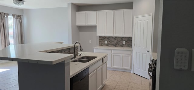 kitchen featuring light tile patterned flooring, a sink, white cabinetry, tasteful backsplash, and black appliances