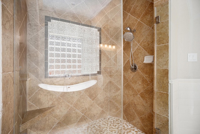 full bathroom with a tile shower