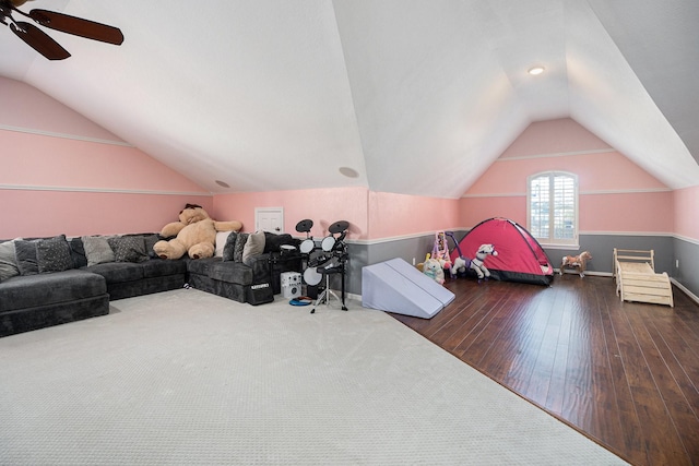 living room with lofted ceiling, wood finished floors, and baseboards