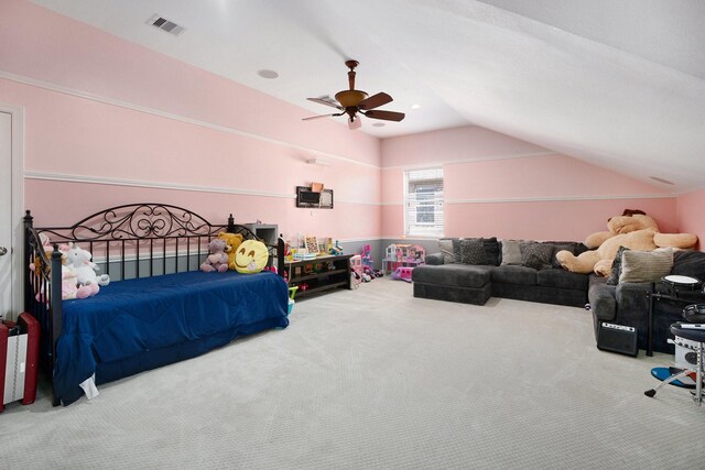 carpeted bedroom featuring visible vents, ceiling fan, and vaulted ceiling