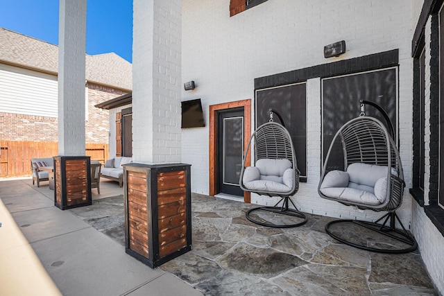 view of patio / terrace with outdoor lounge area and fence