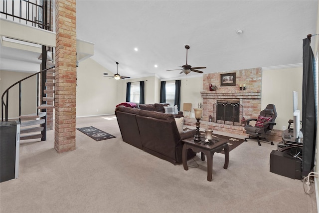 living area with carpet floors, crown molding, a brick fireplace, baseboards, and stairs