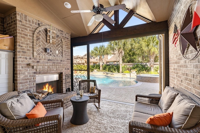 sunroom featuring lofted ceiling, an outdoor brick fireplace, plenty of natural light, and a ceiling fan