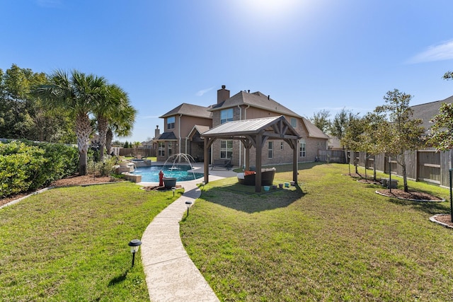 rear view of property featuring a fenced in pool, a fenced backyard, a standing seam roof, a gazebo, and a yard