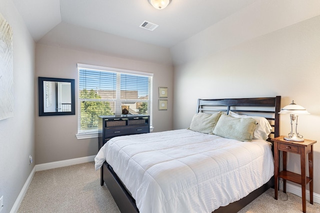 bedroom featuring lofted ceiling, carpet floors, visible vents, and baseboards