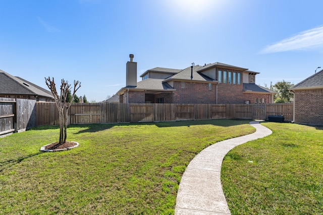 view of yard with a fenced backyard