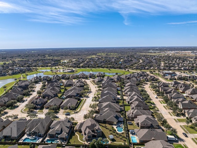 aerial view with a water view and a residential view