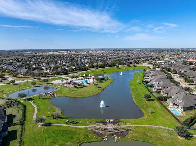 drone / aerial view featuring a water view and a residential view