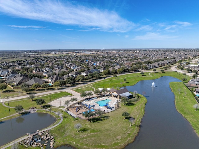 birds eye view of property featuring a water view and a residential view