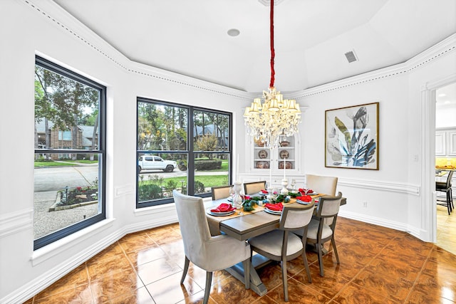 tiled dining space with visible vents, baseboards, lofted ceiling, and a chandelier