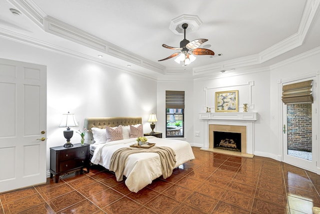 tiled bedroom featuring access to exterior, visible vents, a fireplace with raised hearth, baseboards, and ornamental molding