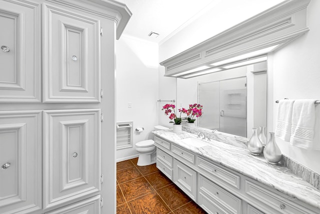 full bathroom featuring vanity, visible vents, ornamental molding, tile patterned floors, and toilet