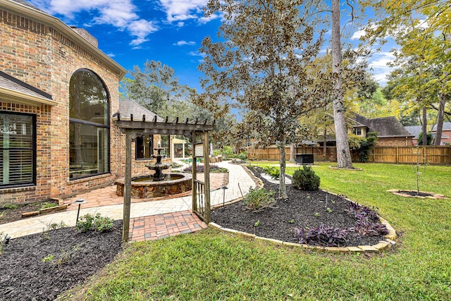 view of yard with a pergola, a patio, and fence