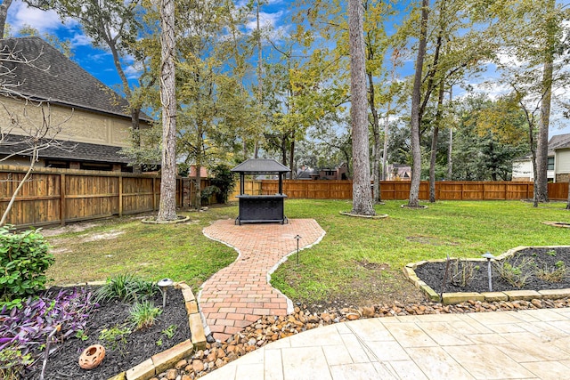 view of yard with a gazebo, a patio, and a fenced backyard