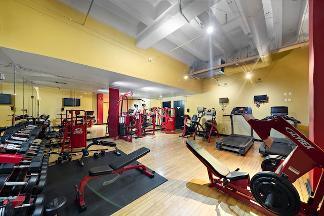 exercise room with wood finished floors