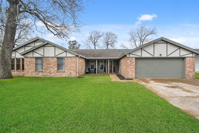 tudor house with a front lawn, brick siding, a garage, and driveway