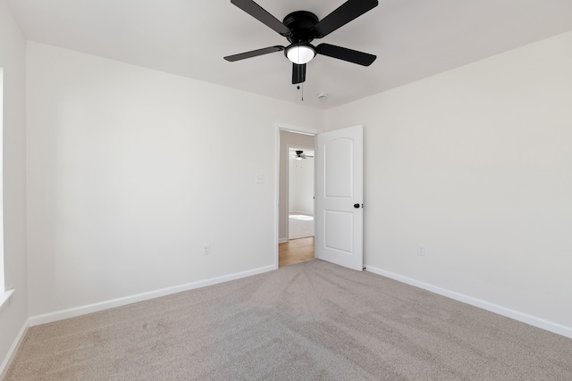 carpeted empty room with baseboards