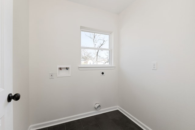 laundry room with washer hookup, dark tile patterned floors, baseboards, hookup for an electric dryer, and laundry area