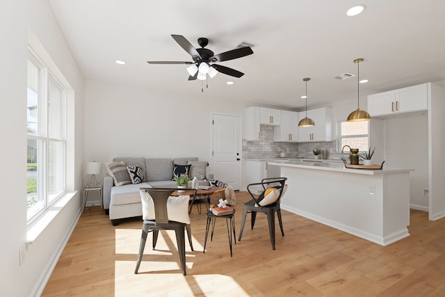 interior space with visible vents, baseboards, recessed lighting, light wood-style floors, and a ceiling fan