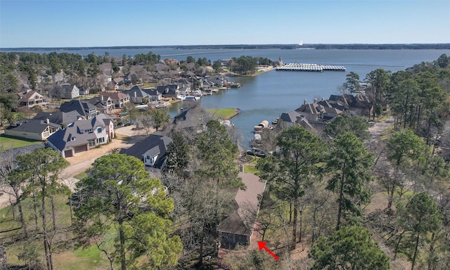 birds eye view of property featuring a residential view and a water view