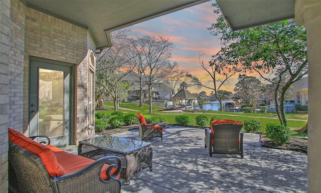 patio terrace at dusk with a lawn