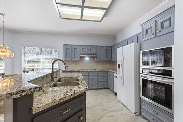 kitchen with a sink, oven, white refrigerator with ice dispenser, under cabinet range hood, and marble finish floor